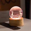 Detailed view of 3D engraved deer crystal ball night light on a wooden base - Loving Elks (Rechargeable)