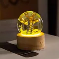 Detailed view of resin crystal ball night light with golden money tree and wooden base - Rising High Elk (Rechargeable)