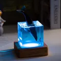 Close-up of a blue resin ocean whale night light on a wooden base for home decor - Humpback Whale (USB Plug-in RGB Base) / 5cm