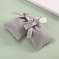 Close-up of elegant grey velvet jewelry pouches with decorative satin ribbon bows - 6x13cm / Gray
