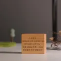 Detailed view of the personalized laser engraving on a natural wooden baby keepsake box - Engraved Pattern (Personalization Support) / Natural Wood Color