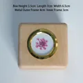 Detailed view of square wooden storage box for first hair with pink flower detail - Maple Box with Pink Flower Specimen