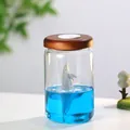 Luce notturna decorativa con un delfino in resina in liquido blu e tappo in legno - Delfino in Bottiglia