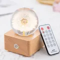 Elegant dandelion crystal ball music box featuring a wooden base and wireless remote - Dandelion (A20)