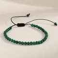 Close-up view of a green malachite gemstone beaded adjustable braided yoga bracelet - Malachite