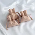 Elegant custom microfiber drawstring jewelry pouches in soft peach with embossed logos - 7*8cm / Nude Pink
