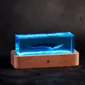 Elegant blue ocean resin whale night light sculpture with a natural solid wood base - Blue Whale / Rechargeable Model
