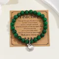 Detail of green natural stone bead bracelet with silver apple charm on gift card - Emerald Green