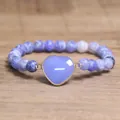 Close-up of 8mm blue cracked agate beaded bracelet with heart-shaped stone pendant - Weathered Purple Agate