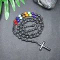 Primer plano de collar chakra de piedra de lava de 8 mm con colgante de cruz de hematita. - Lava Multicolor
