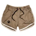 Detail showing the breathable mesh fabric and paw print logo on brown athletic shorts. - M / Bottoms / Khaki White Border