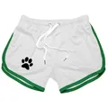 Detailed view of white mesh sports shorts featuring green trim and black paw print logo - M / Bottoms / White Green Edge
