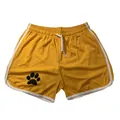 Gelbe Mesh-Sportshorts mit schwarzem Pfotenabdruck und weißem Besatz - Gelb Weißer Rand