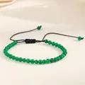 Detailed view of 4mm natural green agate beads on an adjustable black woven cord bracelet - Malaysian Jade