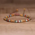 Close-up of 2x4mm natural stone beads on a handmade adjustable braided bracelet. - Picture Jasper Silver Spacer Style / Silver
