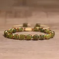Detailed close-up of a 4mm natural stone braided bracelet with colorful silk thread - Taiwan Jade
