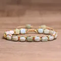 Close-up detail of adjustable handmade woven bracelet with 4mm natural tourmaline stone beads - Amazonite