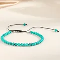 Macro detail of a 4mm turquoise-colored stone bead yoga bracelet with adjustable cord - Turquoise