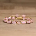 Detailed shot of 4mm pink natural stone beads wrapped in colorful woven adjustable cord - Rose Quartz