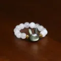 Close-up of shell pearl beaded ring featuring a cute grey bunny-shaped centerpiece - Rabbit / White Black