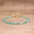 Close-up of a handmade green faceted natural stone bead bracelet with gold hardware - Green Agate