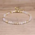 Detailed close-up of faceted natural stone beads on a bohemian style gold bracelet - Citrine