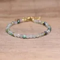 Close-up of faceted natural stone beads on a handmade bohemian adjustable bracelet - Moss Agate