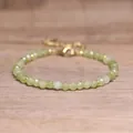 Macro view of faceted green natural stone beads on a bohemian style adjustable bracelet. - Taiwan Jade