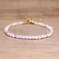 Macro view of faceted pink natural stone beads on a Bohemian style handmade adjustable bracelet - Pink Aventurine