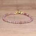 Close-up of natural pink stone faceted beads on a handmade adjustable bohemian bracelet. - Strawberry Quartz