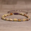 Handmade adjustable natural stone rectangle bead bracelet with silver spacers on wood surface - Picture Jasper