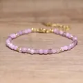 Macro view of faceted light purple natural stone beads on a handmade bohemian bracelet - Lepidolite