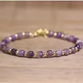 Elegant purple amethyst beaded bracelet with gold accents on natural wood background - Purple Crystal / 4*6mm