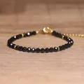 Handgemaakte armband van zwarte natuursteen kralen met een verstelbare gouden ketting - Zwarte agaat