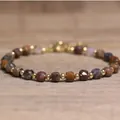 Elegant handmade natural stone beaded bracelet with 4x6mm faceted multi-colored gems - Pietersite / 4*6mm