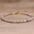 Handmade faceted pink natural stone bead bracelet with small golden accents on wood - Argentina Rhodochrosite / 4*6mm