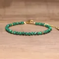 Faceted green malachite-style beaded bracelet with adjustable gold chain link. - Malachite