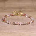 Faceted natural stone beaded bracelet featuring adjustable gold-tone clasp and chain - Copper Rutilated Quartz