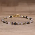 Elegant handmade 4x6mm faceted natural stone beaded bracelet with gold spacers - Black Rutilated Quartz / 4*6mm