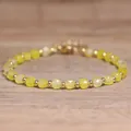 Handmade yellow faceted natural stone beaded bracelet with golden metal spacers. - Agate / 4*6mm
