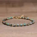 Handmade natural stone beaded bracelet with turquoise faceted beads and gold accents. - African Pine Stone / 4*6mm