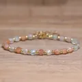 Handmade beaded bracelet with 4x6mm natural sunstone and faceted crystal beads on wood - Arusha Sunstone / 4*6mm