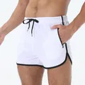 Men's white quick-dry athletic shorts featuring black piping and adjustable drawstring - L / Bottoms / White
