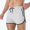 Pantalones cortos deportivos gris claro hombre secado rápido con bolsillo y cremallera - Gris claro