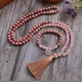 Close-up of a 108-bead Mala necklace and bracelet set with pink stones and a tassel - Necklace and Bracelet Set / Rose Quartz Pink (2)