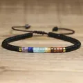 Handmade adjustable woven bracelet featuring seven colorful natural chakra stones - Black Base 7 Chakra Stones