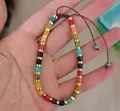 Adjustable colorful natural stone bead bracelet with gold spacers and braided brown cord - 4x4 Colorful Imperial Stone