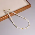 Handgemaakte witte natuurstenen kralenketting met gouden spacers, verstelbaar - Witte Maansteen