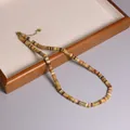 Collana boho fatta a mano con perle in pietra naturale e inserti dorati raffinati - Diaspro Giallo