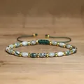 Detailed view of handmade moss agate beaded bracelet with green woven adjustable cord - Green/White
